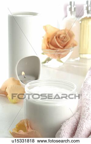 Aroma lamp, rose blossom and cream pot View Large Photo Image Stock Photo - Aroma lamp, rose blossom and cream pot. Fotosearch