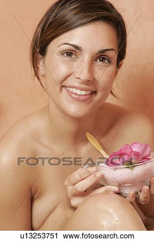 Woman with a bowl with bath salts and petals View Large Photo Image Stock Image - Woman with a bowl with bath salts and petals. Fotosearch