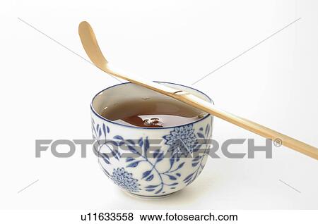 A cup of tea with a bamboo spoon View Large Photo Image Stock Photo - A cup of tea with a bamboo spoon. Fotosearch