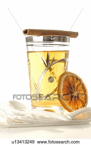 A glass of tea with candy stick and a slice of orange View Large Photo Image Stock Photo - A glass of tea with candy stick and a slice of orange. Fotosearch