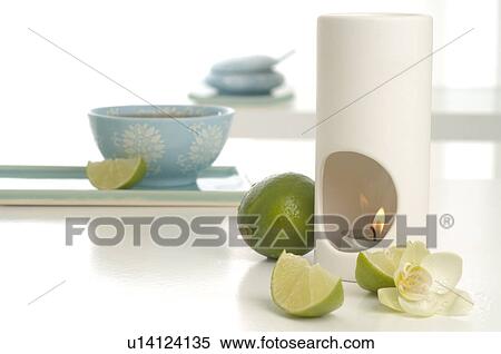 Aroma lamp, limes and orchid blossoms View Large Photo Image Stock Photography - Aroma lamp, limes and orchid blossoms. Fotosearch