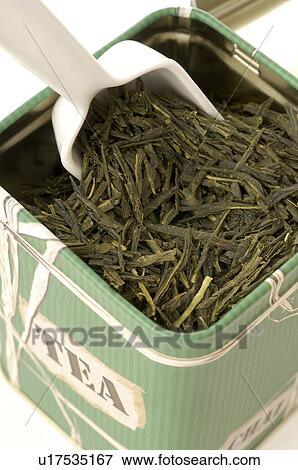 Stock Photo - Green tea in a tea caddy. Fotosearch