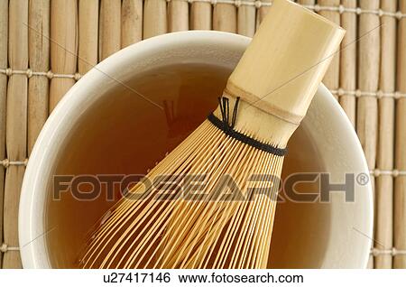 Stock Photograph - Maccha besom in a tea bowl. Fotosearch