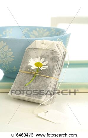 Stock Image - Tea bag with camomile. Fotosearch