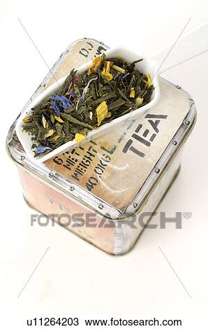 Stock Image - Tea caddy and a porcelain scoop. Fotosearch