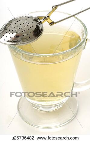 Tea infuser and a tea glass View Large Photo Image Stock Image - Tea infuser and a tea glass. Fotosearch