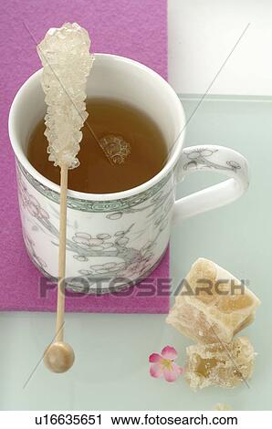 Tea mug with a candy stick View Large Photo Image Stock Image - Tea mug with a candy stick. Fotosearch