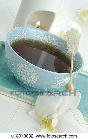 Teacup with a candy stick View Large Photo Image Stock Image - Teacup with a candy stick. Fotosearch