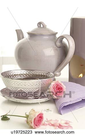 Teapot, silver teacup, aroma lamp and roses View Large Photo Image Stock Image - Teapot, silver teacup, aroma lamp and roses. Fotosearch