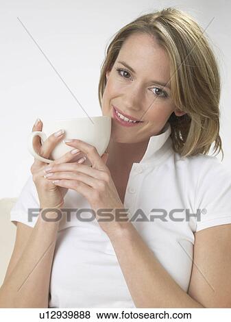 Stock Photo - Woman drinking a cup of tea. Fotosearch