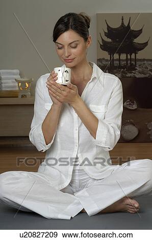 Stock Photo - Woman with a cup of tea. Fotosearch