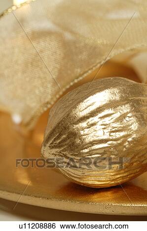 Stock Photograph - Golden walnut. Fotosearch
