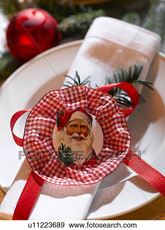 Stock Photo - Napkin decorated with a Santa Claus wafer. Fotosearch