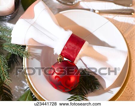 Place cover with a white napkin, a red Christmas tree ball and a fir branch View Large Photo Image Stock Photo - Place cover with a white napkin, a red Christmas tree ball and a fir branch. Fotosearch