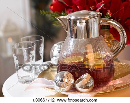Stock Image - Punchbowl with twists of orange. Fotosearch