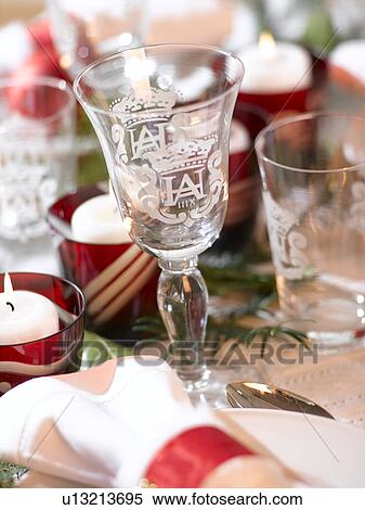 Stock Photography - Wine glass on a Christmas table. Fotosearch