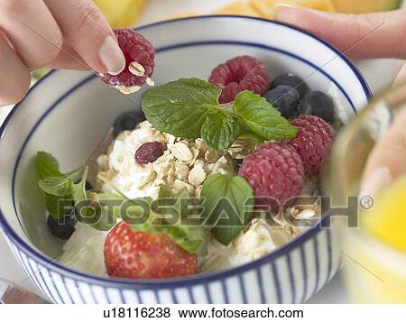 Stock Photo - Cereals with berries and quark. Fotosearch