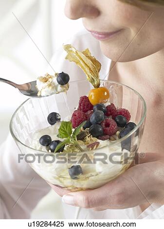 Stock Photography - Cereals with berries and quark. Fotosearch
