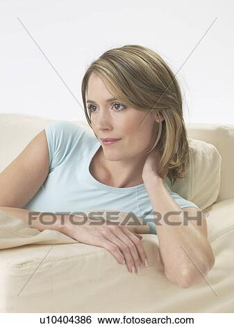 Woman on the sofa View Large Photo Image Stock Photograph - Woman on the sofa. Fotosearch