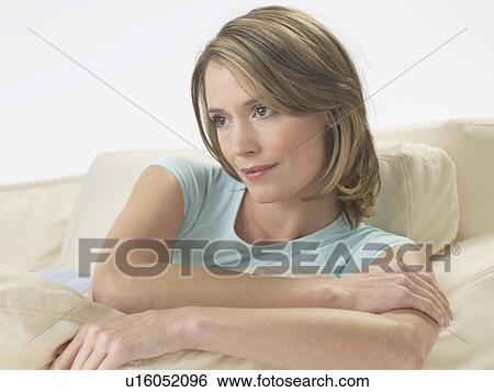 Woman on the sofa View Large Photo Image Stock Photograph - Woman on the sofa. Fotosearch