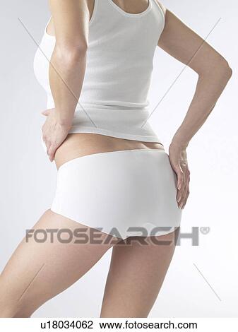Woman wearing white underwear, cut of waist and backside View Large Photo Image Stock Image - Woman wearing white underwear, cut of waist and backside. Fotosearch