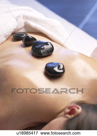 Stock Photo - Hot stone massage. Fotosearch