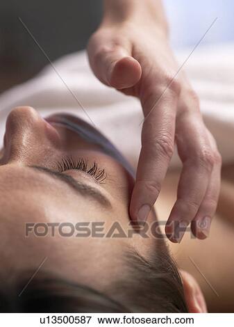 Woman getting a facial massage View Large Photo Image Stock Photo - Woman getting a facial massage. Fotosearch