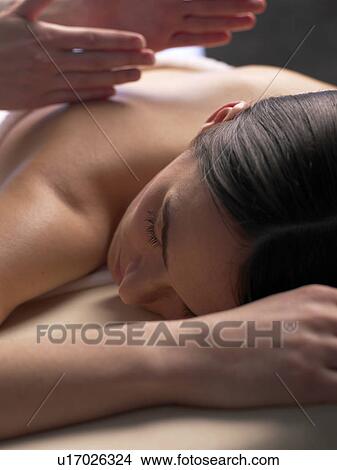Woman getting a massage View Large Photo Image Picture - Woman getting a massage. Fotosearch