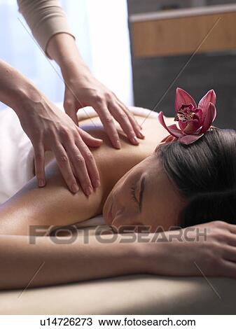 Woman getting a massage View Large Photo Image Stock Image - Woman getting a massage. Fotosearch