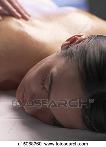 Woman getting a massage View Large Photo Image Stock Image - Woman getting a massage. Fotosearch