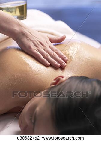 Woman getting a massage View Large Photo Image Stock Image - Woman getting a massage. Fotosearch