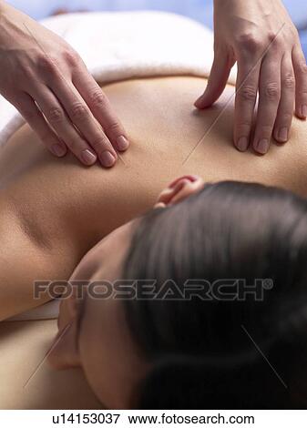 Woman getting a massage View Large Photo Image Stock Photo - Woman getting a massage. Fotosearch