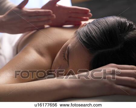 Stock Photograph - Woman getting a massage. Fotosearch