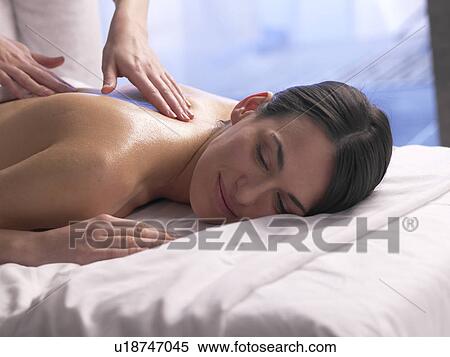 Woman getting a massage View Large Photo Image Stock Photography - Woman getting a massage. Fotosearch