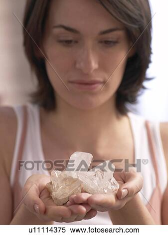 Woman is holding crystalls View Large Photo Image Stock Photography - Woman is holding crystalls. Fotosearch