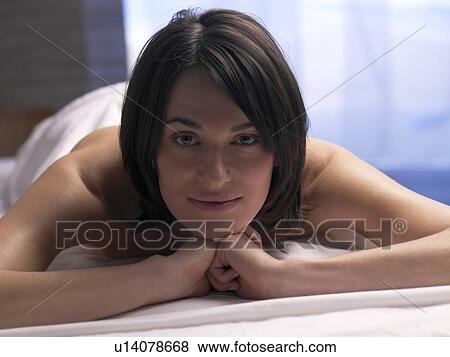 Woman on a massage table View Large Photo Image Stock Photo - Woman on a massage table. Fotosearch