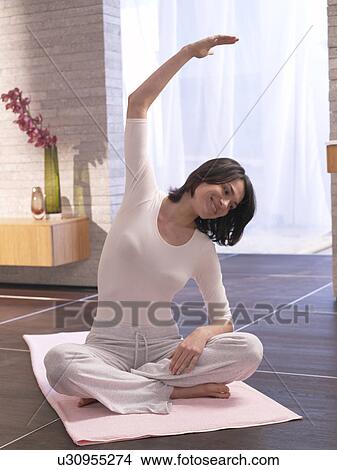 Woman practising yoga View Large Photo Image Picture - Woman practising yoga. Fotosearch