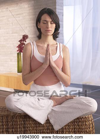Woman practising yoga View Large Photo Image Stock Image - Woman practising yoga. Fotosearch