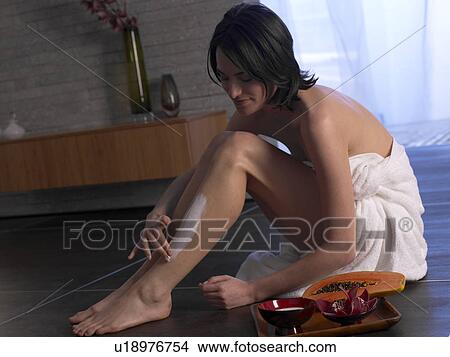 Woman sitting on the floor View Large Photo Image Picture - Woman sitting on the floor. Fotosearch