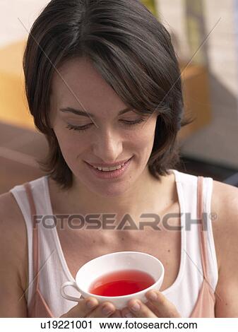 Woman with a cup of tea View Large Photo Image Stock Image - Woman with a cup of tea. Fotosearch
