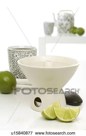 Stock Photo - Aroma lamp with lime. Fotosearch