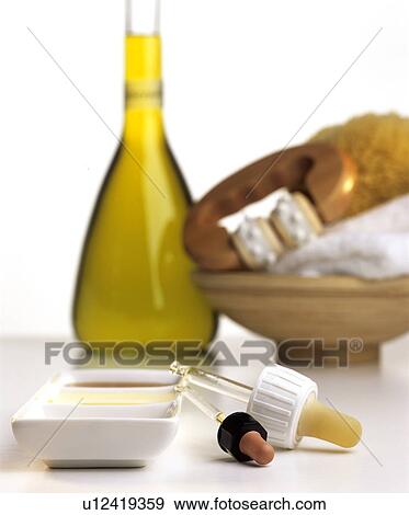 Differend kinds of ethereal oils in a bowl, pipettes and olive oil View Large Photo Image Stock Photo - Differend kinds of ethereal oils in a bowl, pipettes and olive oil. Fotosearch