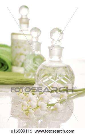 Stock Photography - Flakon with lily of the valley fragrance. Fotosearch