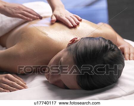 Woman getting a massage View Large Photo Image Stock Photo - Woman getting a massage. Fotosearch