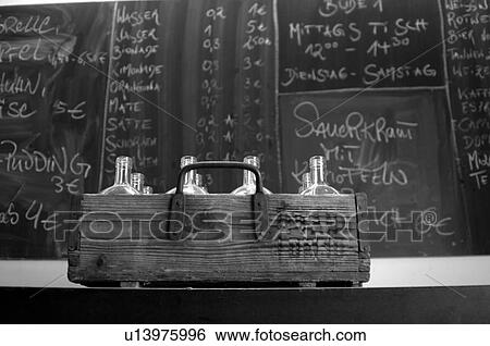 Bottles in front of a menu card View Large Photo Image Stock Photograph - Bottles in front of a menu card. Fotosearch