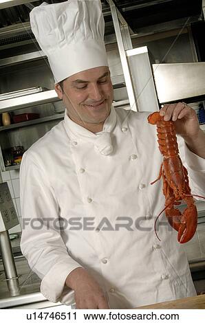 Stock Image - Cooking lobster. Fotosearch
