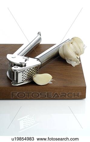 Garlic and garlic press View Large Photo Image Stock Image - Garlic and garlic press. Fotosearch