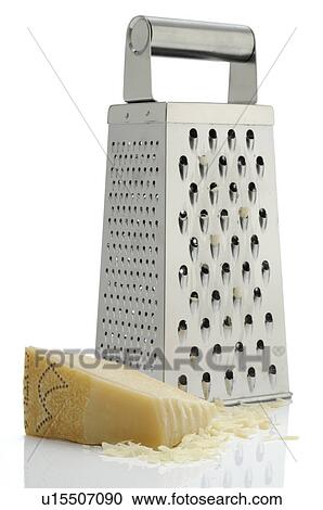 Stock Image - Grating parmesan. Fotosearch