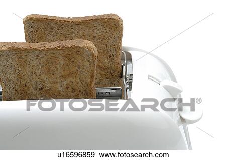 Toast in a toaster View Large Photo Image Stock Photo - Toast in a toaster. Fotosearch
