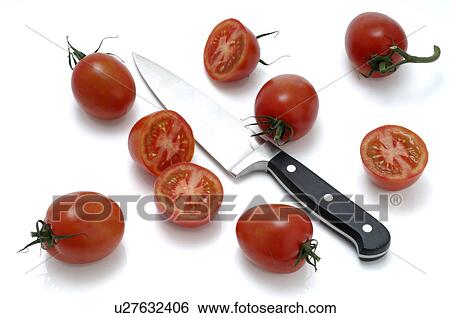Tomatoes and a knife View Large Photo Image Stock Photograph - Tomatoes and a knife. Fotosearch